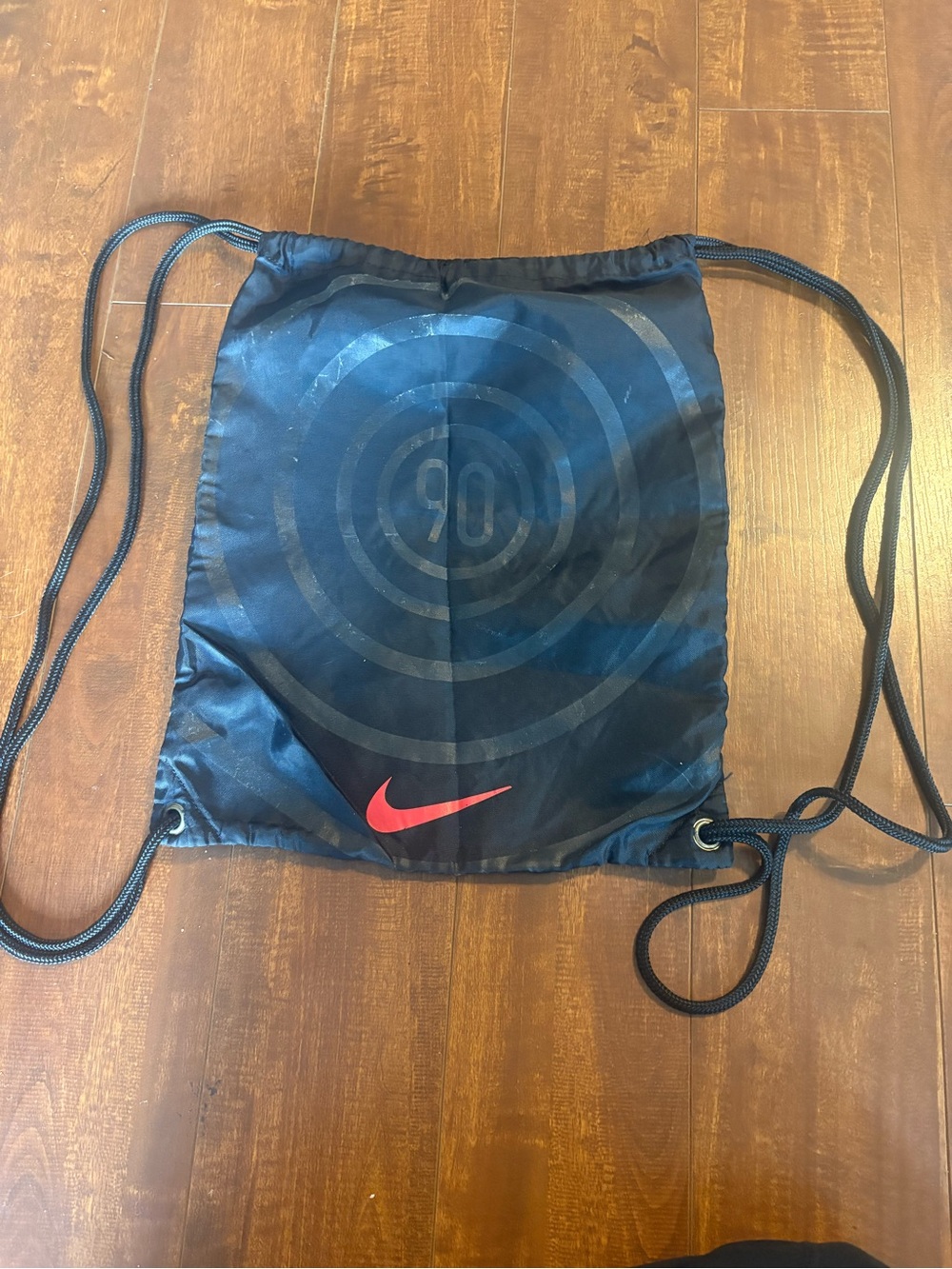 Nike Black Drawstring Backpack with Red Swoosh and Concentric Target